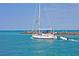 Sailboat approaching the harbor with a small motorboat at 335 Pembroke S Ln # 229, Venice, FL 34293