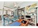 Sunroom with glass walls, a seating area, and a workspace at 335 Pembroke S Ln # 229, Venice, FL 34293
