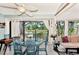Relaxing sunroom features water views and comfortable seating at 335 Pembroke S Ln # 229, Venice, FL 34293