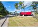 Two train cars in a park-like setting at 335 Pembroke S Ln # 229, Venice, FL 34293