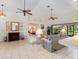 Spacious living area showcasing a view into the Primary bedroom and access to backyard at 337 Flamingo Blvd, Port Charlotte, FL 33954