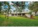 Backyard of house featuring a screened patio at 339 Meadow Beauty Ct, Venice, FL 34293