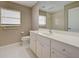 Clean bathroom with white vanity and tiled floor at 339 Meadow Beauty Ct, Venice, FL 34293