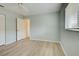 Simple bedroom with laminate flooring and an interior door at 339 Meadow Beauty Ct, Venice, FL 34293