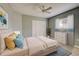 Bright bedroom featuring a queen-size bed and built-in closet at 339 Meadow Beauty Ct, Venice, FL 34293