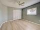 Spacious bedroom with ceiling fan and laminate flooring at 339 Meadow Beauty Ct, Venice, FL 34293