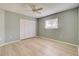 Simple bedroom with laminate flooring and built-in closet at 339 Meadow Beauty Ct, Venice, FL 34293