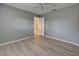 Simple bedroom with wood-look flooring and an ensuite bathroom at 339 Meadow Beauty Ct, Venice, FL 34293
