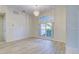 Dining room with large window and light wood flooring at 339 Meadow Beauty Ct, Venice, FL 34293