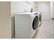 Laundry room with washer, dryer, and overhead shelving at 339 Meadow Beauty Ct, Venice, FL 34293