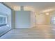 Living room with wood-look floors and sliding glass doors at 339 Meadow Beauty Ct, Venice, FL 34293