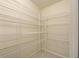 Well-organized pantry featuring wire shelving at 339 Meadow Beauty Ct, Venice, FL 34293