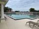 Inviting community pool with lounge chairs at 339 Meadow Beauty Ct, Venice, FL 34293