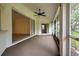 Enclosed porch with access to backyard at 339 Meadow Beauty Ct, Venice, FL 34293
