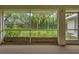 Screened porch with view of the backyard at 339 Meadow Beauty Ct, Venice, FL 34293