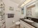 Small bathroom with fish-themed decor at 341 Pembroke Ln # 227, Venice, FL 34293