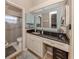 Bathroom with granite vanity and updated fixtures at 341 Pembroke Ln # 227, Venice, FL 34293