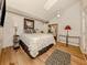 Bedroom with wood floors and skylight at 341 Pembroke Ln # 227, Venice, FL 34293