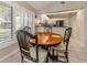 Bright dining area with table and chairs, view to kitchen at 341 Pembroke Ln # 227, Venice, FL 34293