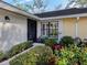 Inviting exterior with landscaped walkway, lush greenery, and a charming entrance at 341 Pembroke Ln # 227, Venice, FL 34293