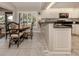 Kitchen with granite counters and white cabinets at 341 Pembroke Ln # 227, Venice, FL 34293