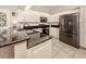 Sleek kitchen with granite countertops and island at 341 Pembroke Ln # 227, Venice, FL 34293