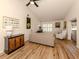 Relaxing living room with hardwood floors, comfortable seating, and large windows at 341 Pembroke Ln # 227, Venice, FL 34293