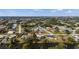 Wide aerial view of a residential neighborhood featuring diverse homes, green spaces and waterways at 3560 Middletown St, Port Charlotte, FL 33952