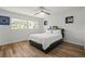 Bright bedroom with ceiling fan, a double bed and wooden floors at 3560 Middletown St, Port Charlotte, FL 33952