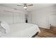 Bedroom featuring wood-look flooring, double bed, ceiling fan and wardrobe at 3560 Middletown St, Port Charlotte, FL 33952