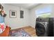 Bright laundry room with modern appliances, natural light, and cozy seating area at 3560 Middletown St, Port Charlotte, FL 33952
