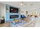 Bright living room features a built-in entertainment center and an open floor plan with a dining area at 3560 Middletown St, Port Charlotte, FL 33952
