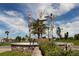 Modern abstract metal sculpture in a landscaped circular fountain at 4060 Barbary Ln, North Port, FL 34287