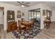 Bright dining area with wood table and access to backyard at 4060 Barbary Ln, North Port, FL 34287