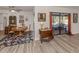 Bright dining area with wood table and access to backyard at 4060 Barbary Ln, North Port, FL 34287