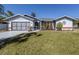 Single-story home with attached garage and well-manicured lawn at 4060 Barbary Ln, North Port, FL 34287