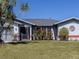Charming single-story home with lush landscaping and a tree of life at 4060 Barbary Ln, North Port, FL 34287