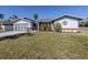 Single story home with a two-car garage, and nicely landscaped lawn at 4060 Barbary Ln, North Port, FL 34287