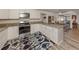Updated kitchen with granite countertops and stainless steel appliances at 4060 Barbary Ln, North Port, FL 34287