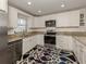 Modern kitchen featuring granite countertops and stainless steel appliances at 4060 Barbary Ln, North Port, FL 34287
