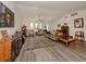 Spacious living room featuring hardwood floors and ample natural light at 4060 Barbary Ln, North Port, FL 34287