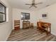 Home office with wood desk and built-in shelving at 4060 Barbary Ln, North Port, FL 34287