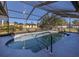 Inviting kidney-shaped pool with a screened enclosure at 4060 Barbary Ln, North Port, FL 34287