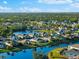 Aerial view showcasing a single-Gathering home's screened lanai overlooking a serene lake at 4264 Wordsworth Way, Venice, FL 34293