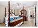 Bright bedroom with a post bed and ample closet space at 4264 Wordsworth Way, Venice, FL 34293