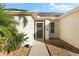 Front entrance with gated pathway and landscaping at 4264 Wordsworth Way, Venice, FL 34293