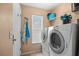 Convenient laundry room with washer, dryer, and storage at 4264 Wordsworth Way, Venice, FL 34293