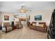 Living room with leather sofas and pool view at 4264 Wordsworth Way, Venice, FL 34293
