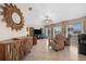 Living room with large sunburst mirror and seating at 4264 Wordsworth Way, Venice, FL 34293