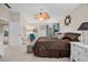 Main bedroom with king-size bed and ensuite bathroom at 4264 Wordsworth Way, Venice, FL 34293